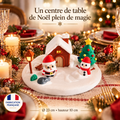 Centre de table village de Noël sur une table dressée