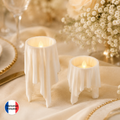 Duo de supports blancs effet tissu drapé avec bougies LED sur une table de mariage